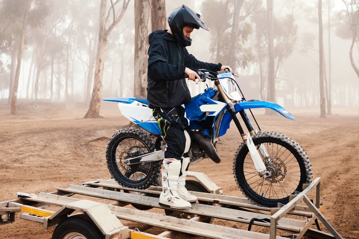 Motorbike, man and sports in forest with training for competition, riding in nature with action and.