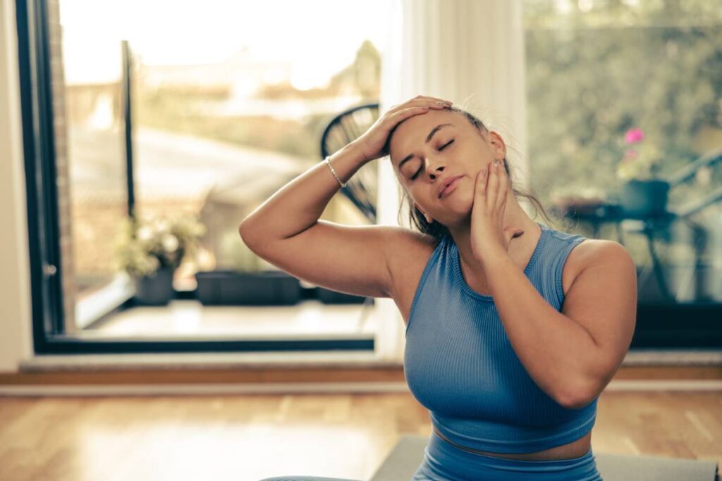 Woman Doing Yoga Stretching Exercises At Home