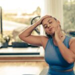 Woman Doing Yoga Stretching Exercises At Home