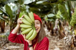 woman-with-banana-stem-on-the-pantation-2023-11-27-05-05-11-utc (1)